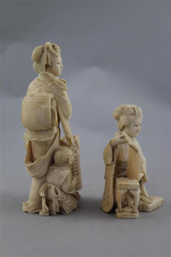 Two Japanese ivory okimono of bijin, Meiji period, 15cm.